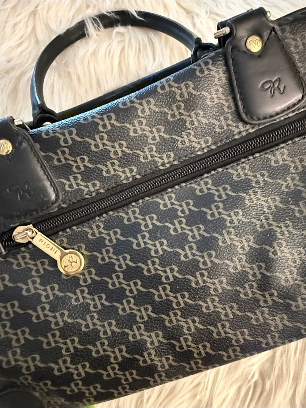 Rioni Signature Organizer Satchel featuring a black monogram 